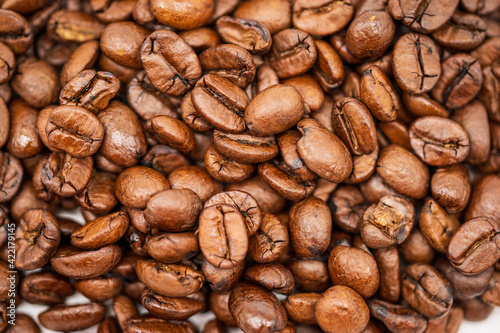  Macro shot of brown freshly roasted coffee beans