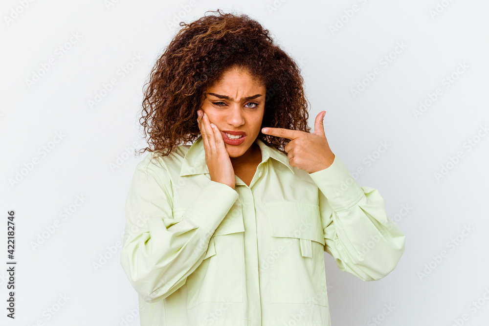 Young african american woman isolated on white background having a strong teeth pain, molar ache.