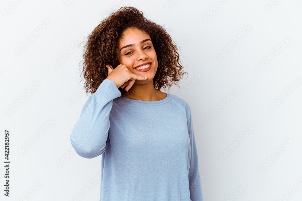 Young african american woman isolated on white background showing a mobile phone call gesture with fingers.
