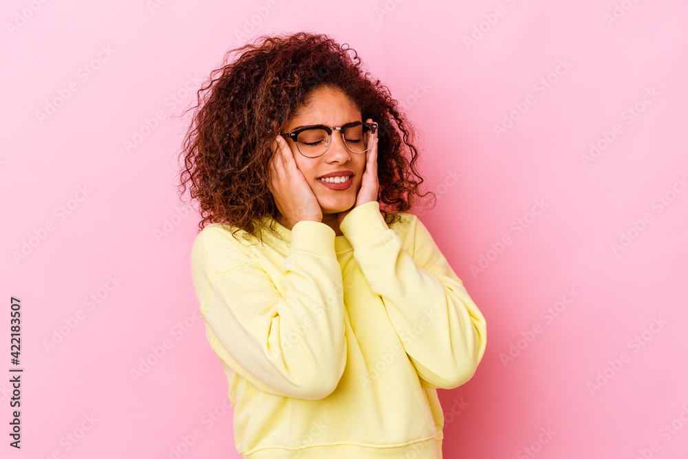 Young african american woman isolated on pink background whining and crying disconsolately.
