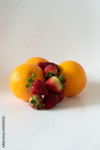 Strawberries and Oranges on White Background
