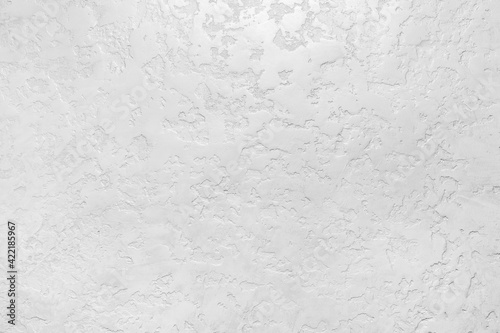 Modern white plaster wall with abstract pattern surface texture background