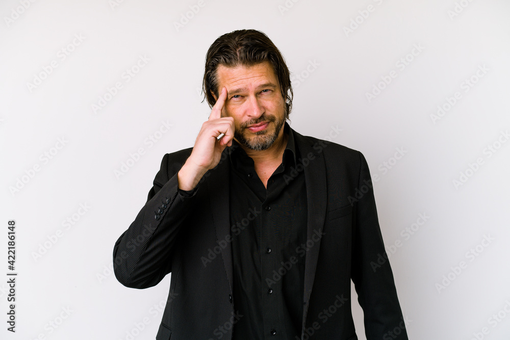 Middle age business dutch man isolated on white background pointing temple with finger, thinking, focused on a task. Middle age business dutch man isolated on white background pointing temple with finger, thinking, focused on a task.