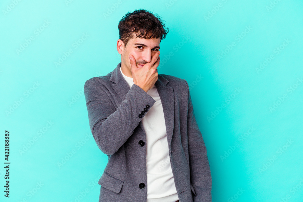 Young caucasian man isolated on blue background scared and afraid. Young caucasian man isolated on blue background scared and afraid.