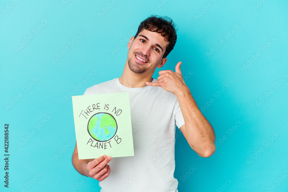 Young caucasian man isolated on white background showing a mobile phone call gesture with fingers. Young caucasian man isolated on white background showing a mobile phone call gesture with fingers.