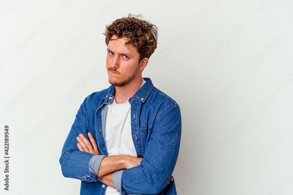Young caucasian man isolated on white background unhappy looking in camera with sarcastic expression. Young caucasian man isolated on white background unhappy looking in camera with sarcastic expression.