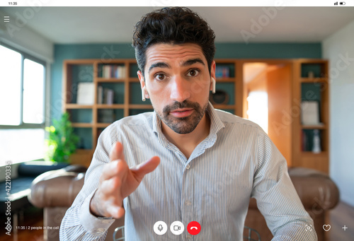 Business man on a work video call from home. photo