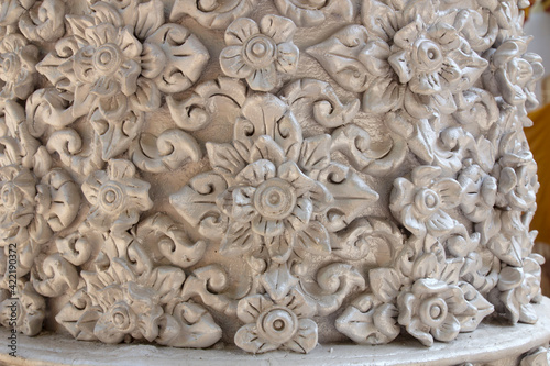 Traditional Thai style stucco on the wall in temple, Thailand.