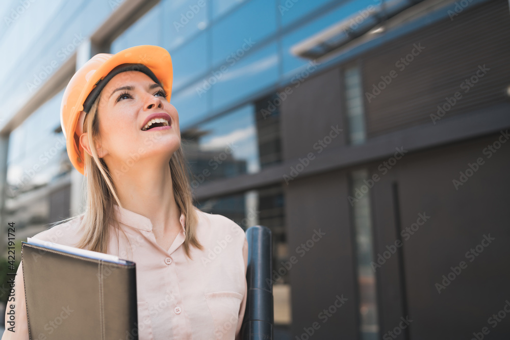 Professional architect woman standing outdoors. Professional architect woman standing outdoors.