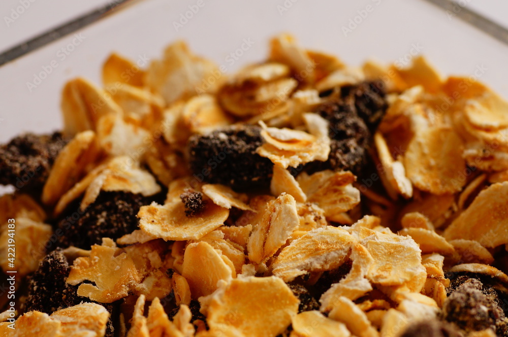 Fototapeta premium Oatmeal with raisins, cinnamon and milk. Food for athletes, vegetarians and dieters.