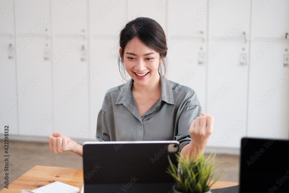 Successful young asian business woman with arms up, work from home concept. Successful young asian business woman with arms up, work from home concept.