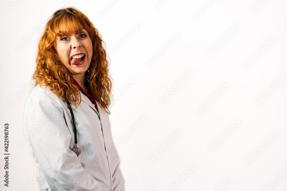 Female doctor pointing her tongue out on an isolated background Female doctor pointing her tongue out on an isolated background
