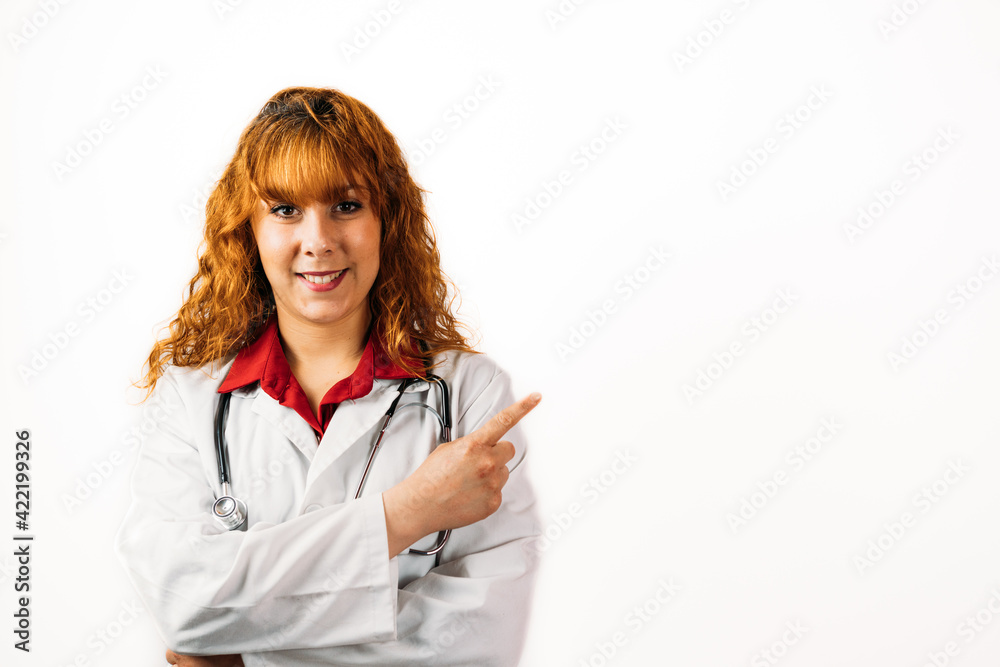 Closeup shot of a female doctor pointing to the blank space - perfect for your text Closeup shot of a female doctor pointing to the blank space - perfect for your text