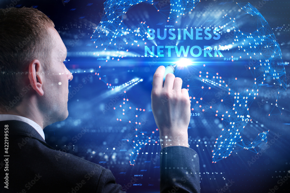 Business, Technology, Internet and network concept. Young businessman working on a virtual screen of the future and sees the inscription: Business network Business, Technology, Internet and network concept. Young businessman working on a virtual screen of the future and sees the inscription: Business network
