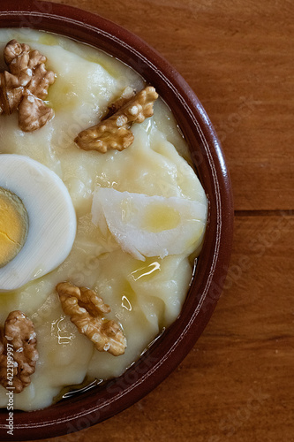 Typical Manchego recipe with cod and potatoes photo