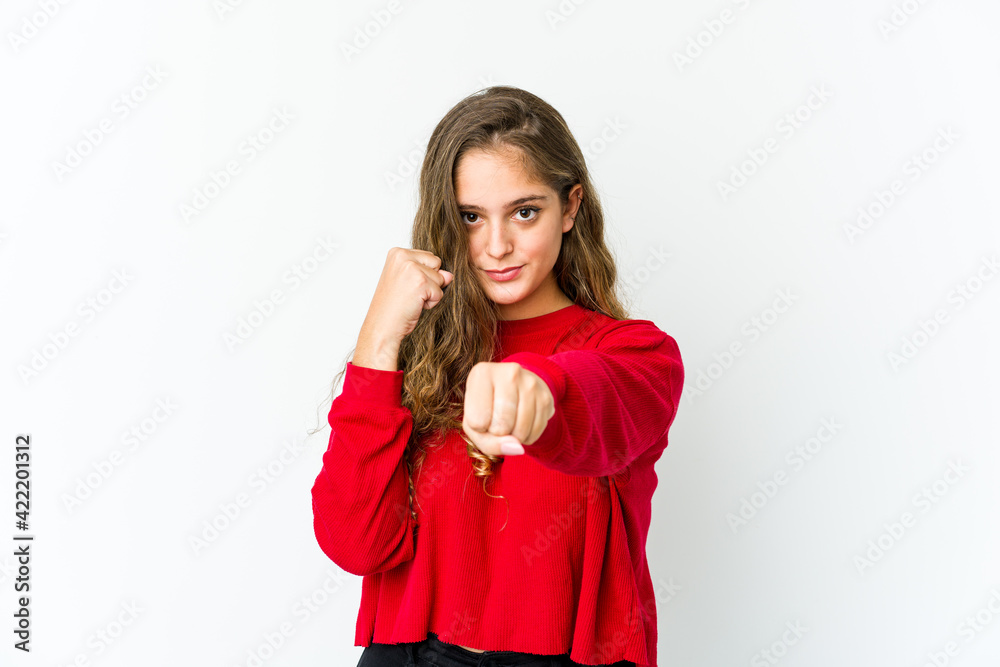 Young caucasian woman throwing a punch, anger, fighting due to an argument, boxing. Young caucasian woman throwing a punch, anger, fighting due to an argument, boxing.