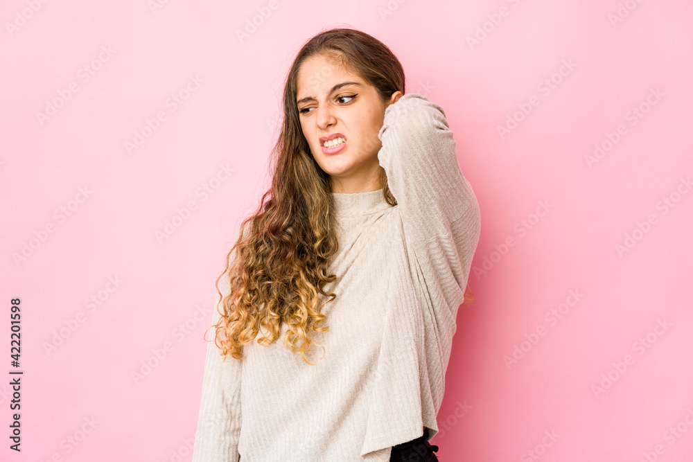 Young caucasian woman tired and very sleepy keeping hand on head.