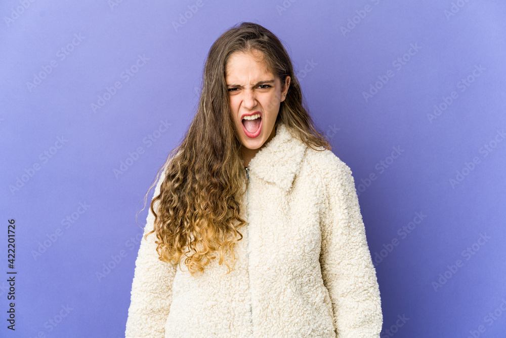 Young caucasian cute woman shouting very angry, rage concept, frustrated.