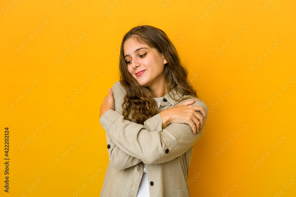 Young caucasian woman hugs, smiling carefree and happy. Young caucasian woman hugs, smiling carefree and happy.