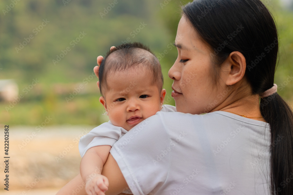 Young Asian mother holding little daughter in the park, Mother play enjoying with her cute baby girl outdoor, copy space
Young Asian mother holding little daughter in the park, Mother play enjoying with her cute baby girl outdoor, copy space