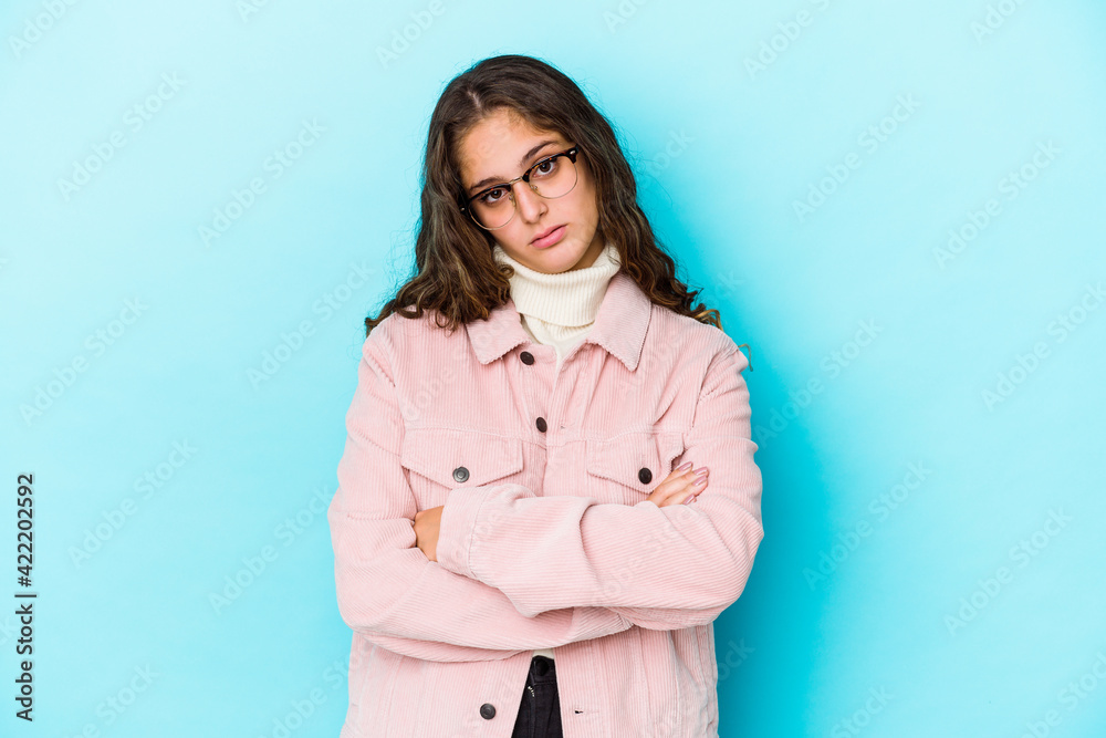 Young caucasian curly hair woman isolated who is bored, fatigued and need a relax day. Young caucasian curly hair woman isolated who is bored, fatigued and need a relax day.