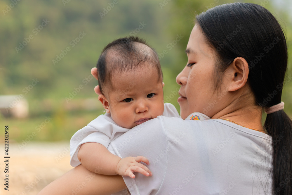 Young Asian mother holding little daughter in the park, Mother play enjoying with her cute baby girl outdoor, copy space
Young Asian mother holding little daughter in the park, Mother play enjoying with her cute baby girl outdoor, copy space