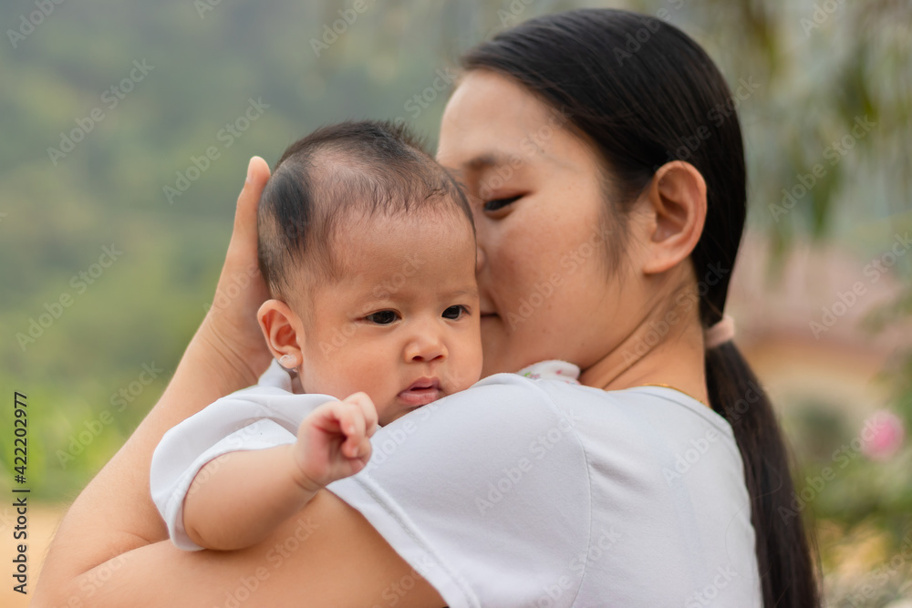 Young Asian mother holding little daughter in the park, Mother play enjoying with her cute baby girl outdoor, copy space
Young Asian mother holding little daughter in the park, Mother play enjoying with her cute baby girl outdoor, copy space