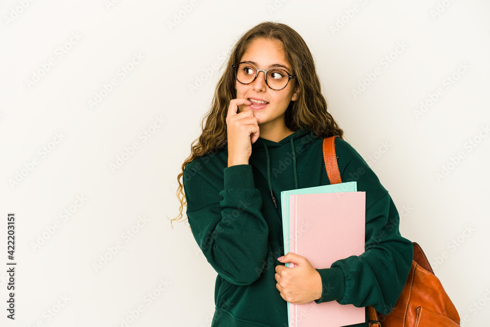 Fototapeta premium Young caucasian student woman isolated relaxed thinking about something looking at a copy space.