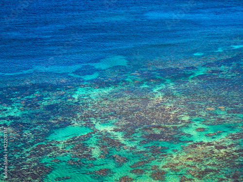 Blue ocean water with coral reef.