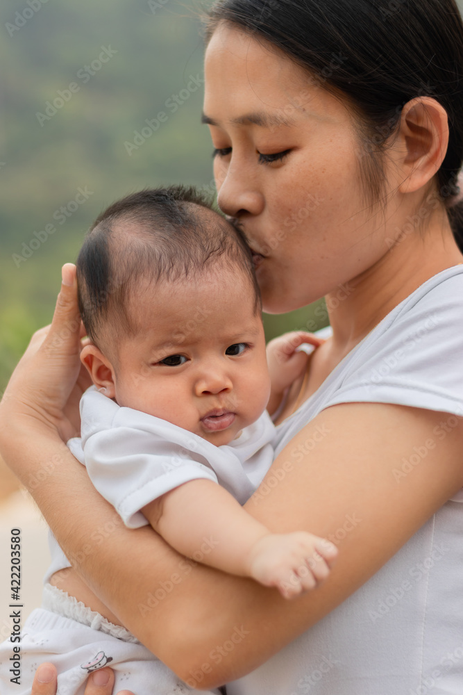 Young Asian mother holding little daughter in the park, Mother play enjoying with her cute baby girl outdoor, copy space
Young Asian mother holding little daughter in the park, Mother play enjoying with her cute baby girl outdoor, copy space