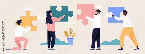 Teamwork and collaboration concept with people with puzzle pieces photo