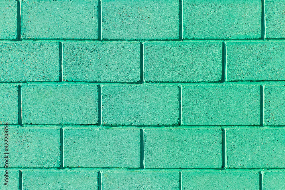 Obraz premium Green or aquamarine wall made of brick blocks color texture azure background