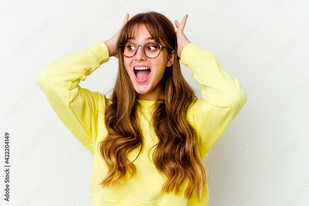 Young caucasian cute woman isolated on white background screaming, very excited, passionate, satisfied with something. Young caucasian cute woman isolated on white background screaming, very excited, passionate, satisfied with something.