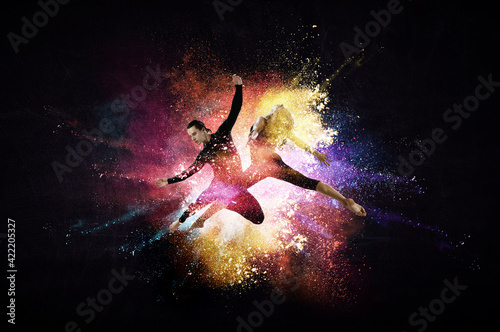Two dancers against abstrac...