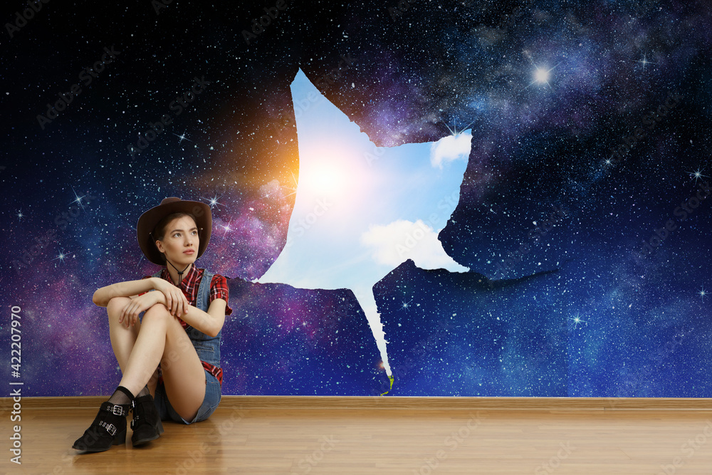 Fototapeta premium Smiling young beautiful woman sitting on the floor. Mixed media