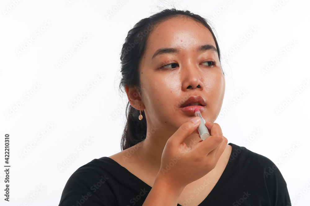 Beautiful woman holding cosmetic product. Beautiful woman holding cosmetic product.