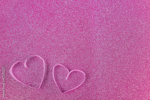 Invitation greeting card for Valentines day. Paper heart on pink shiny glitter template for graphic design. Copy space for text, mock up, festive background.