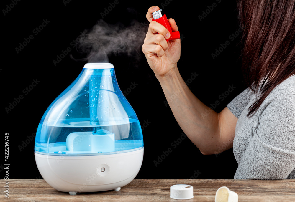 Foto de Asthma, allergy attack concept with ultrasonic air humidifier