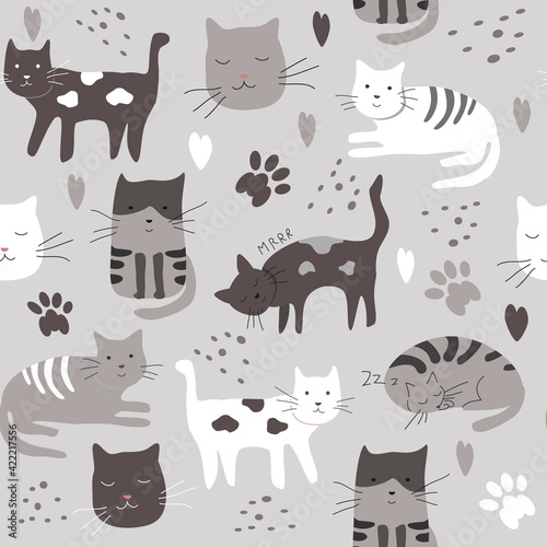 Fototapeta Naklejka Na Ścianę i Meble -  cute vector seamless pattern with hand drawn difference cats, paws, naive childish ornament. pattern for printing on fabric, clothing, wrapping paper, wallpaper for a kid's room, baby things