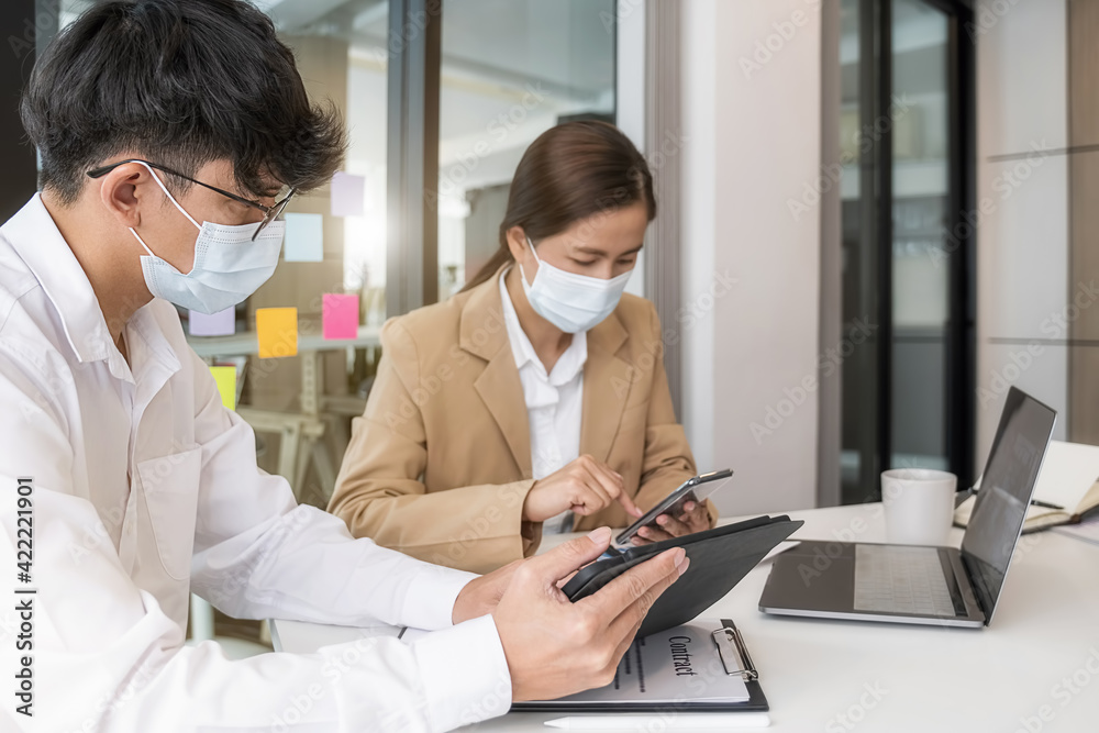 Asian People Successful Teamwork Business Wearing Medical Mask and Working. Work from Private Office Social Distancing among Coronavirus Outbreak Situation Asian People Successful Teamwork Business Wearing Medical Mask and Working. Work from Private Office Social Distancing among Coronavirus Outbreak Situation