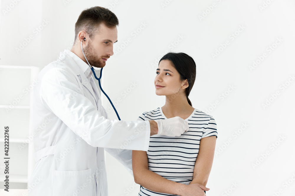 doctor in a white coat stethoscope examination of a patient hospital doctor in a white coat stethoscope examination of a patient hospital