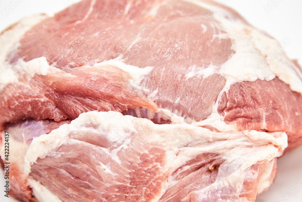 A piece of fresh raw meat pulp on a white background, isolated. The concept of cooking dishes from fresh meat, beef, bones, the best restaurant, delicious cuisine A piece of fresh raw meat pulp on a white background, isolated. The concept of cooking dishes from fresh meat, beef, bones, the best restaurant, delicious cuisine