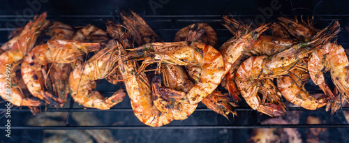 Shrimp, prawns grilled on barbecue fire stove