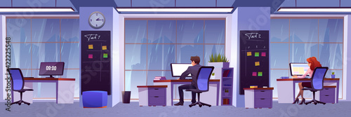 People work in office with rain outside window