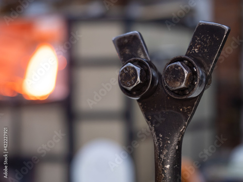 Shining glass blowing furnace at work. Gas kiln in glass design studio photo