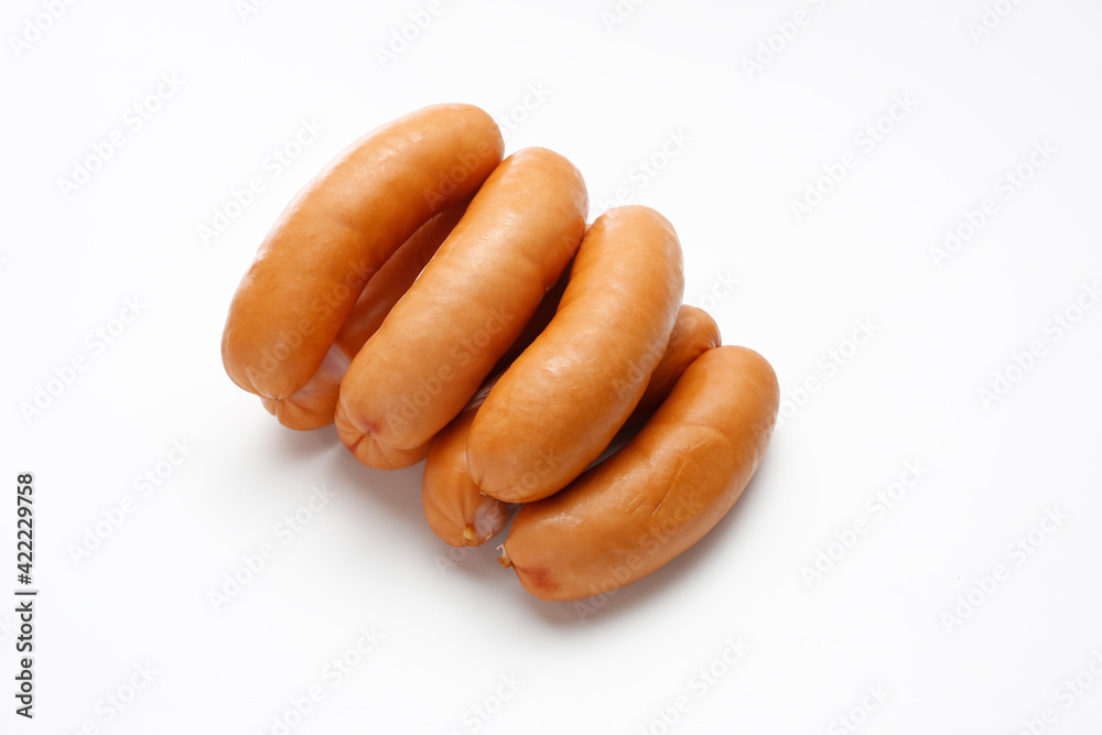 Serdelki, wiener sausages in rings, a packshot photo for package design, template. Polish serdelki, frankfurter, isolated on a white background. Traditional meat product. Serdelki, wiener sausages in rings, a packshot photo for package design, template. Polish serdelki, frankfurter, isolated on a white background. Traditional meat product.