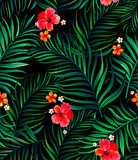 Vector tropical seamless pattern with hibiscus flowers and palm leaves.