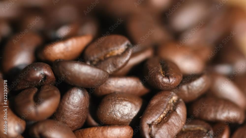 Roasted vietnamese coffee bean. Fragrant coffee beans scrolls slowly around the camera. Slow Motion Close Up of Whole Roasted Coffee Beans.High angle view. 4k resolution Roasted vietnamese coffee bean. Fragrant coffee beans scrolls slowly around the camera. Slow Motion Close Up of Whole Roasted Coffee Beans.High angle view. 4k resolution