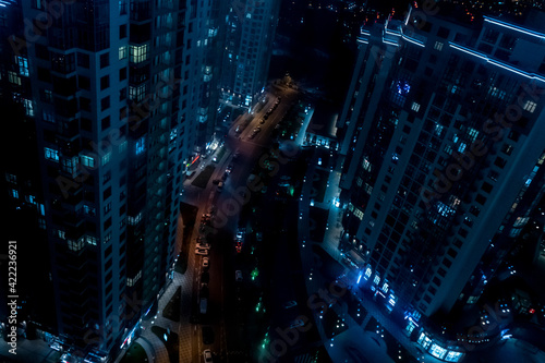 High buildings and night city lights. View from above.