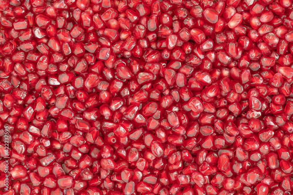 Natural background of red seeds of pomegranate Natural background of red seeds of pomegranate